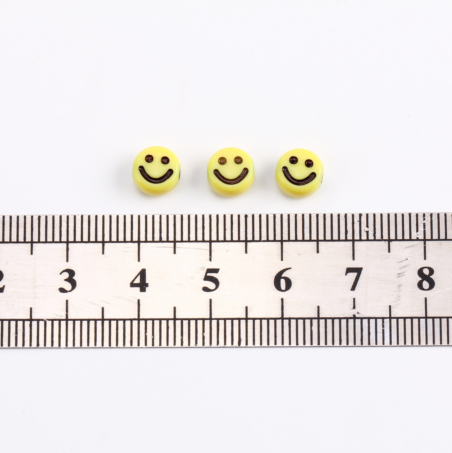 7MM White Flat Round Acrylic with Black Smiley Face Beads