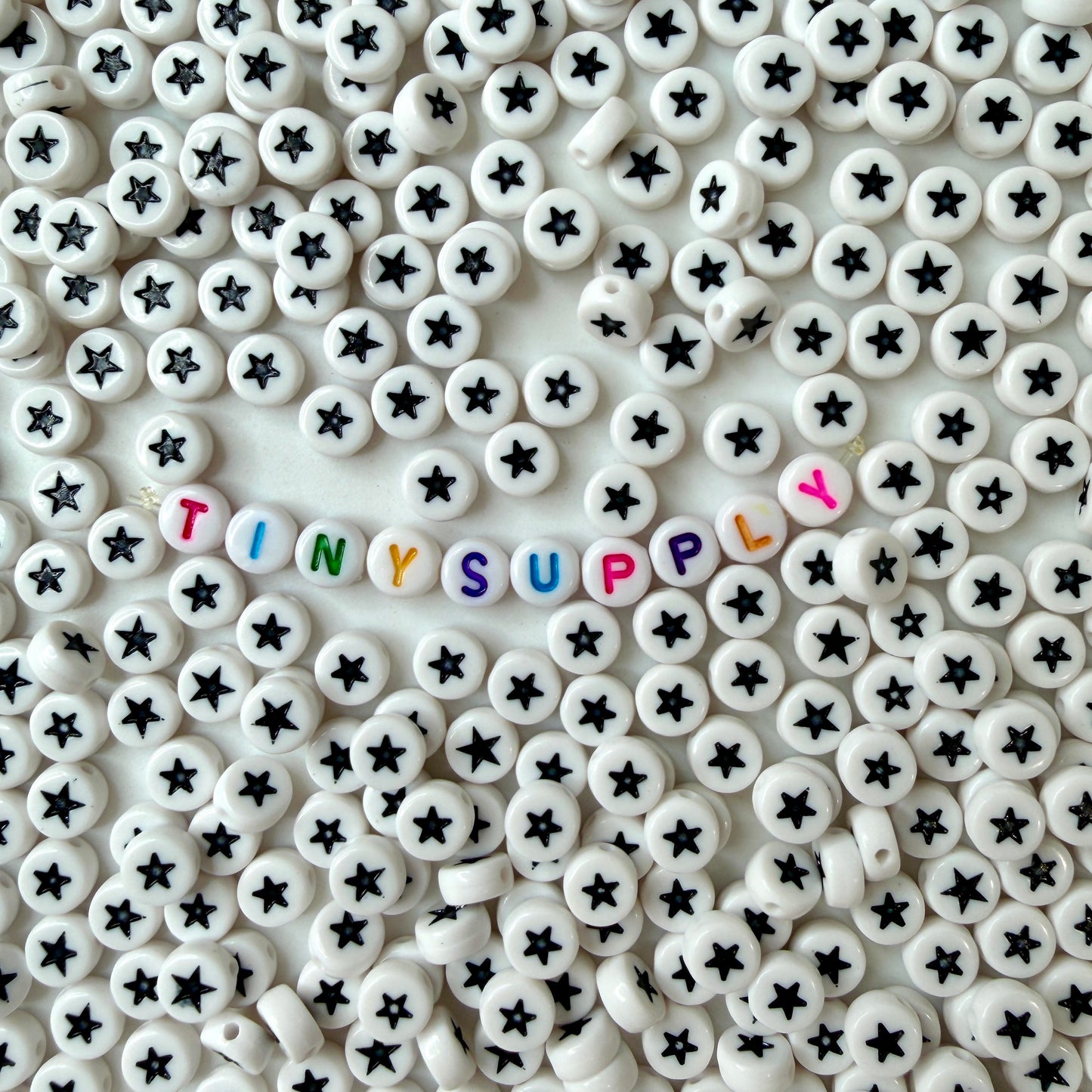 7MM White Flat Round Acrylic with Black Star Beads