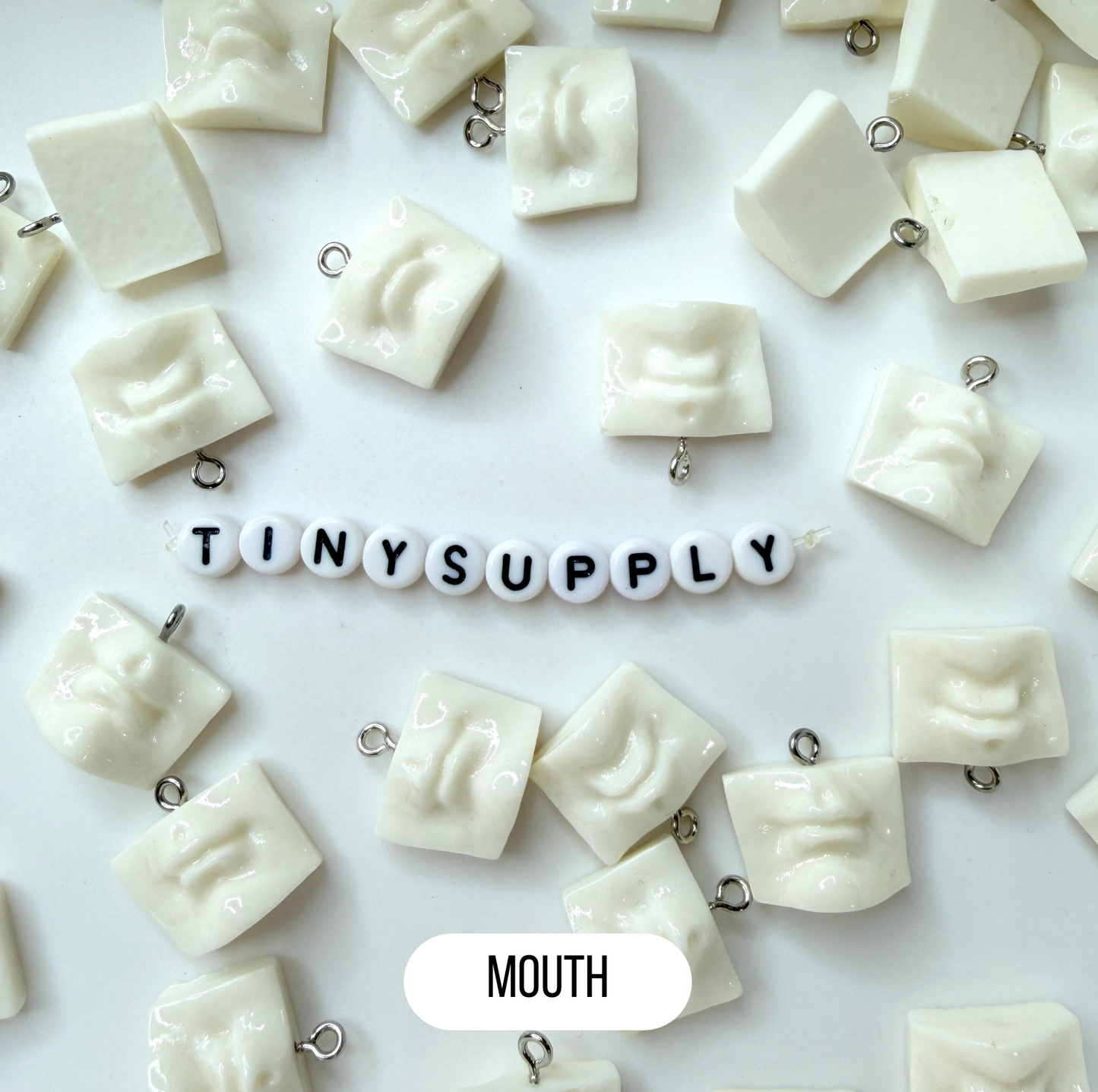 White Sculpture Themed Ear, Eyes, and Mouth Charm