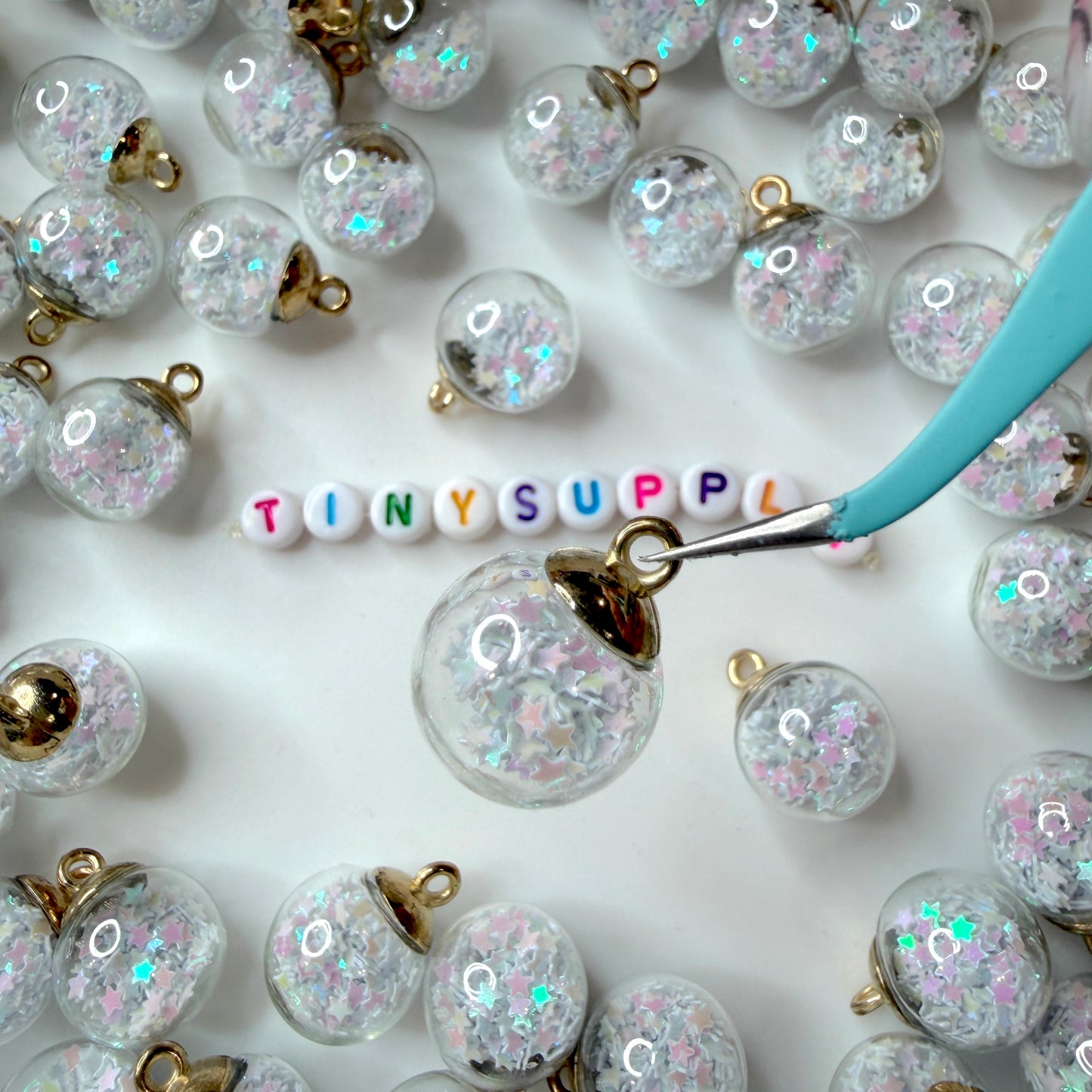 Transparent Glass Orb with Plastic Star Confetti Flakes (21.5mm x 16mm)