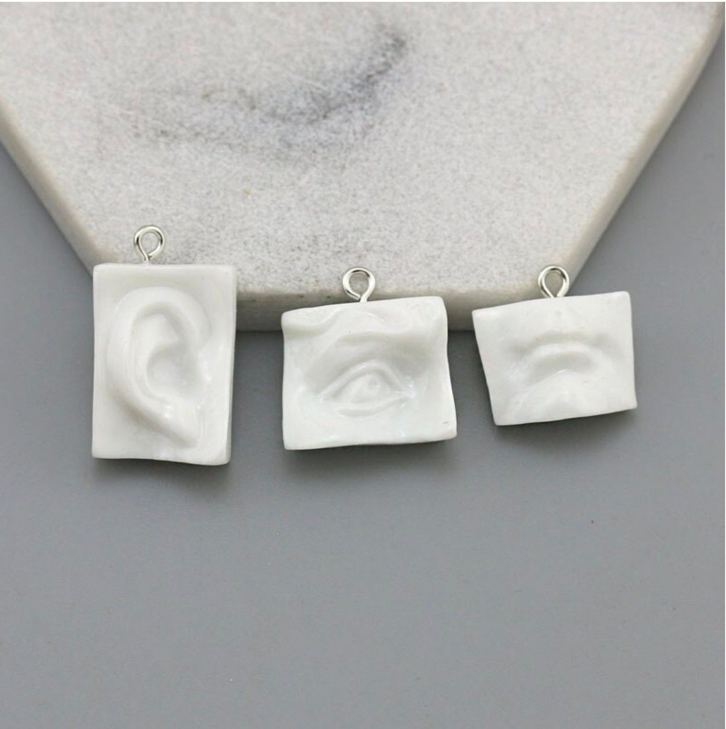 White Sculpture Themed Ear, Eyes, and Mouth Charm