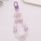 Cute Acrylic Round Strand with Iridescent Paws, Animal Themed Bead Keychain