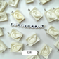 White Sculpture Themed Ear, Eyes, and Mouth Charm