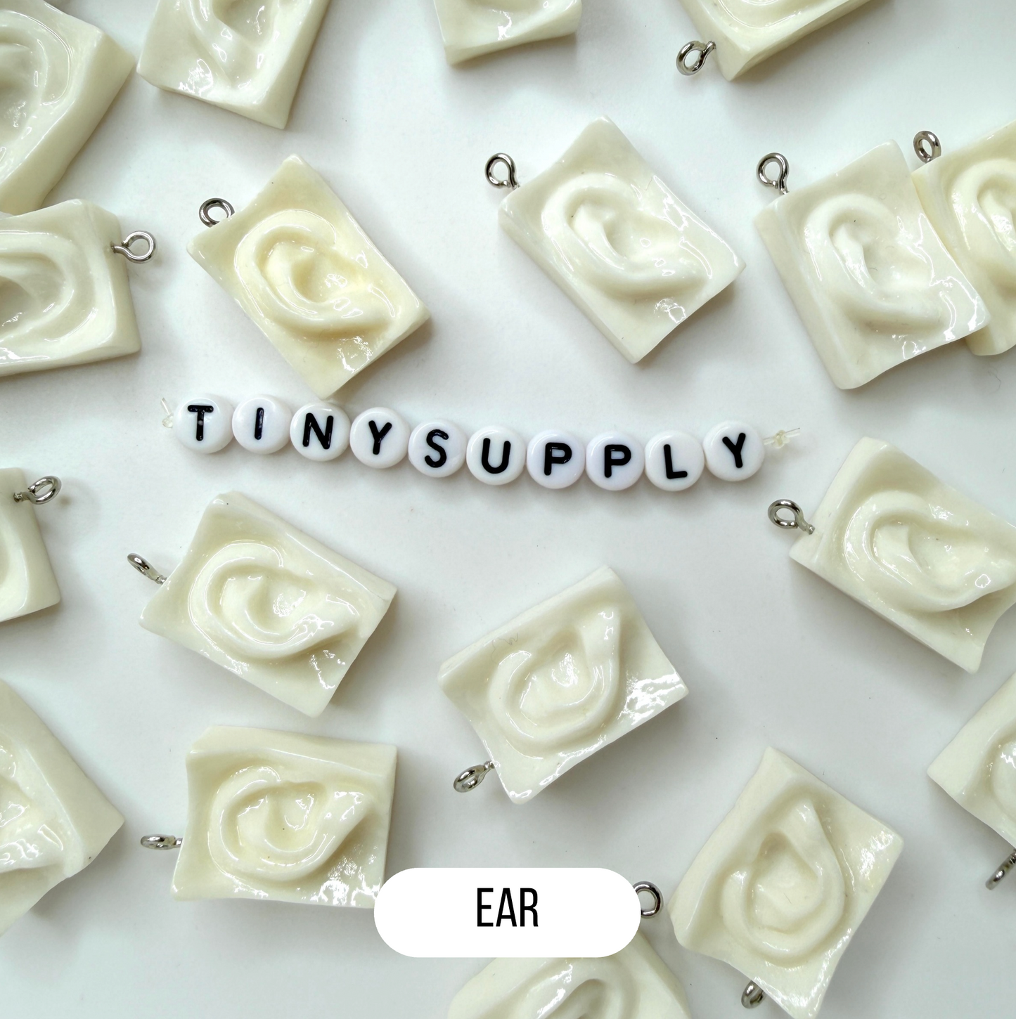 White Sculpture Themed Ear, Eyes, and Mouth Charm