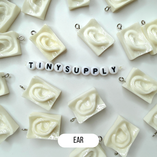 White Sculpture Themed Ear, Eyes, and Mouth Charm