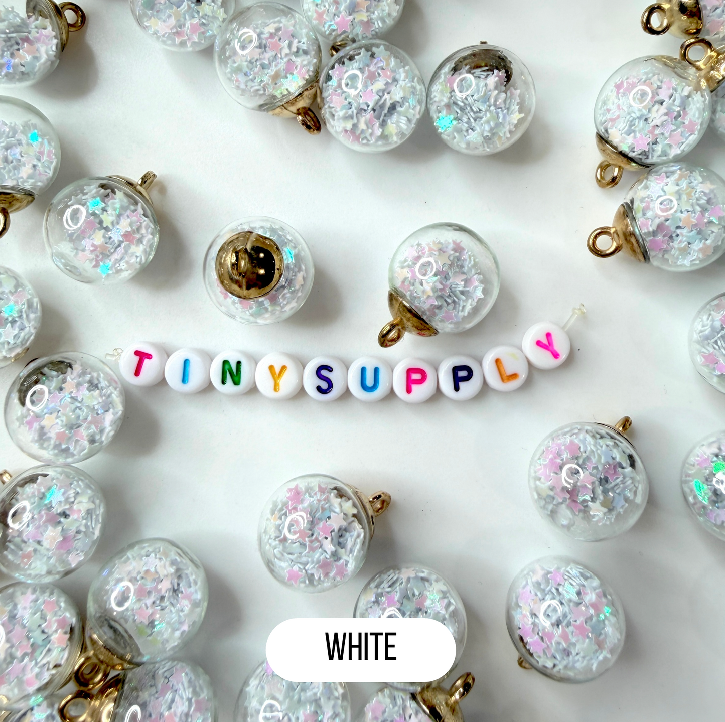 Transparent Glass Orb with Plastic Star Confetti Flakes (21.5mm x 16mm)